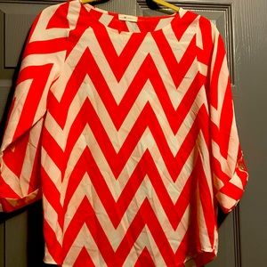Everly chevron blouse orange and white.